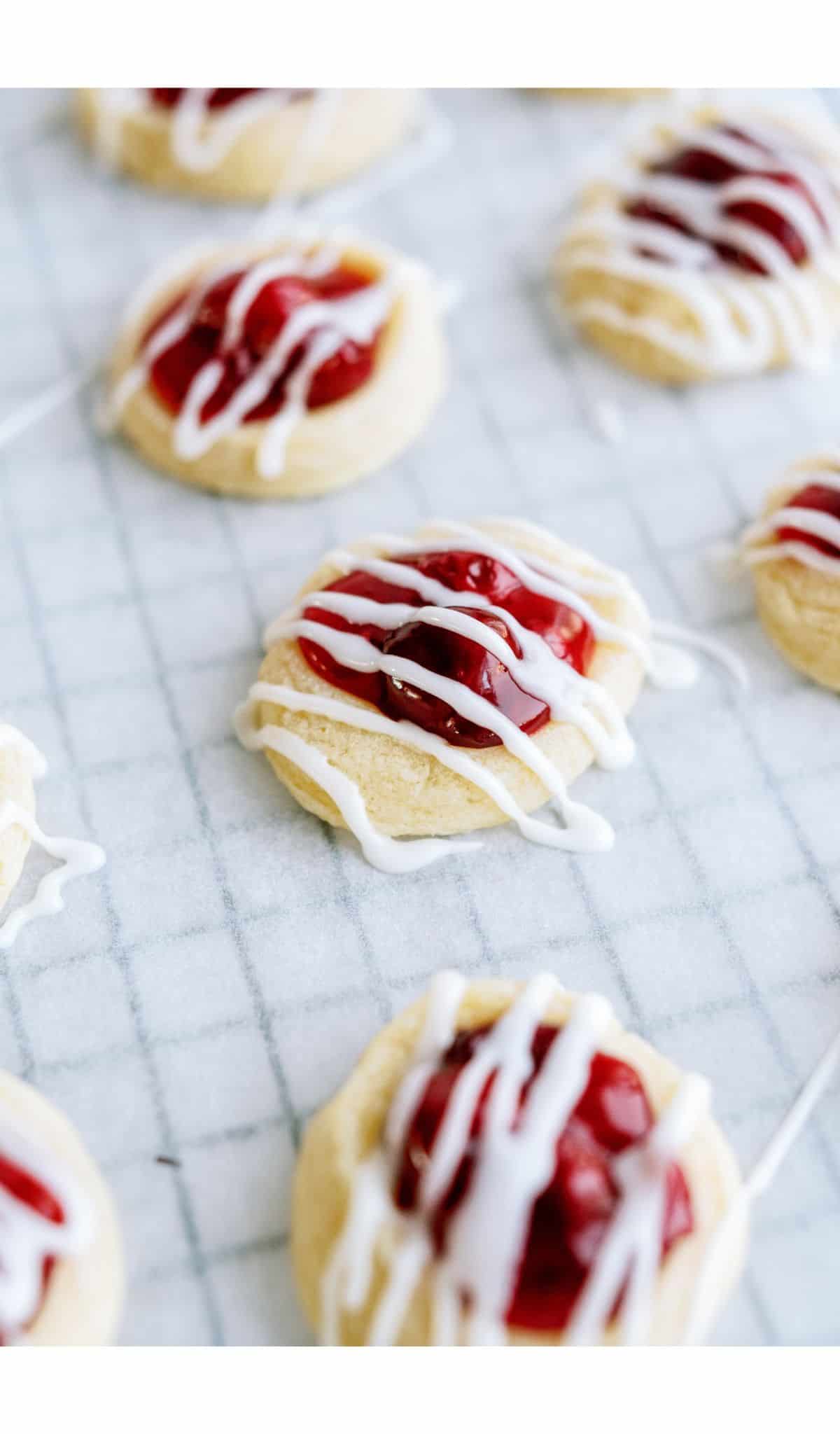 Cherry Danish Cookies on a parchment lined cooling rack.