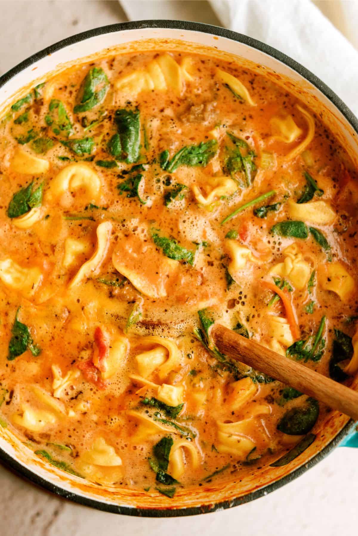 Top view of a large pot of Easy Sausage Tortellini Soup 