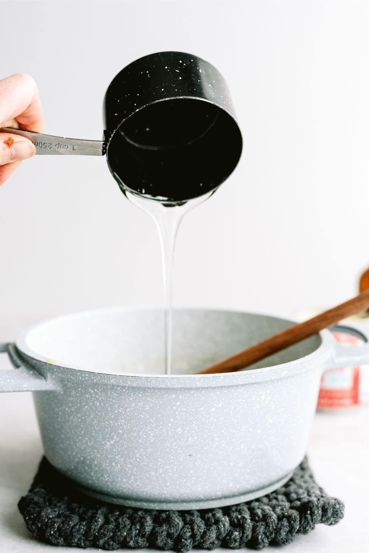 Adding corn syrup to butter and sugar mixture in sauce pan