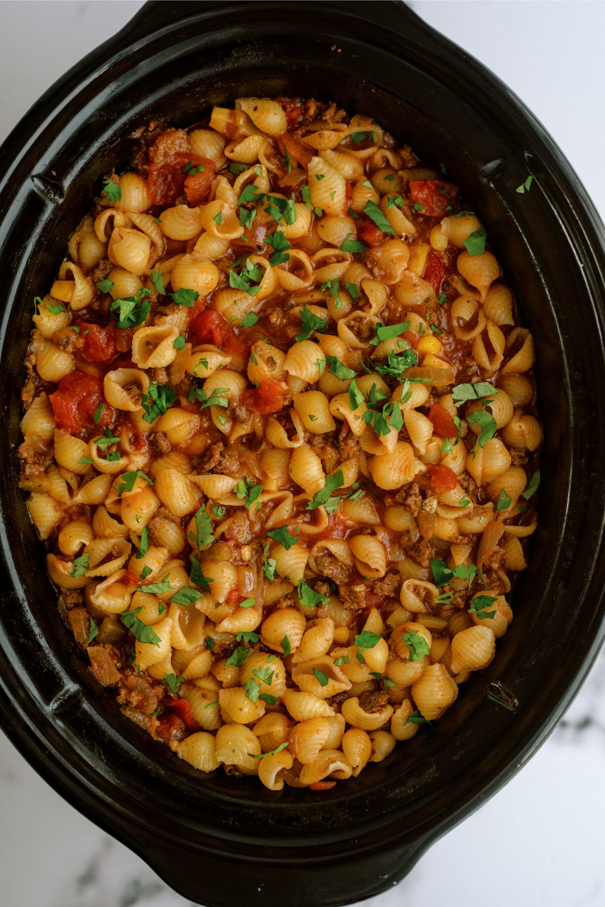 Slow Cooker full of Slow Cooker Cheesy Beef Taco Pasta 