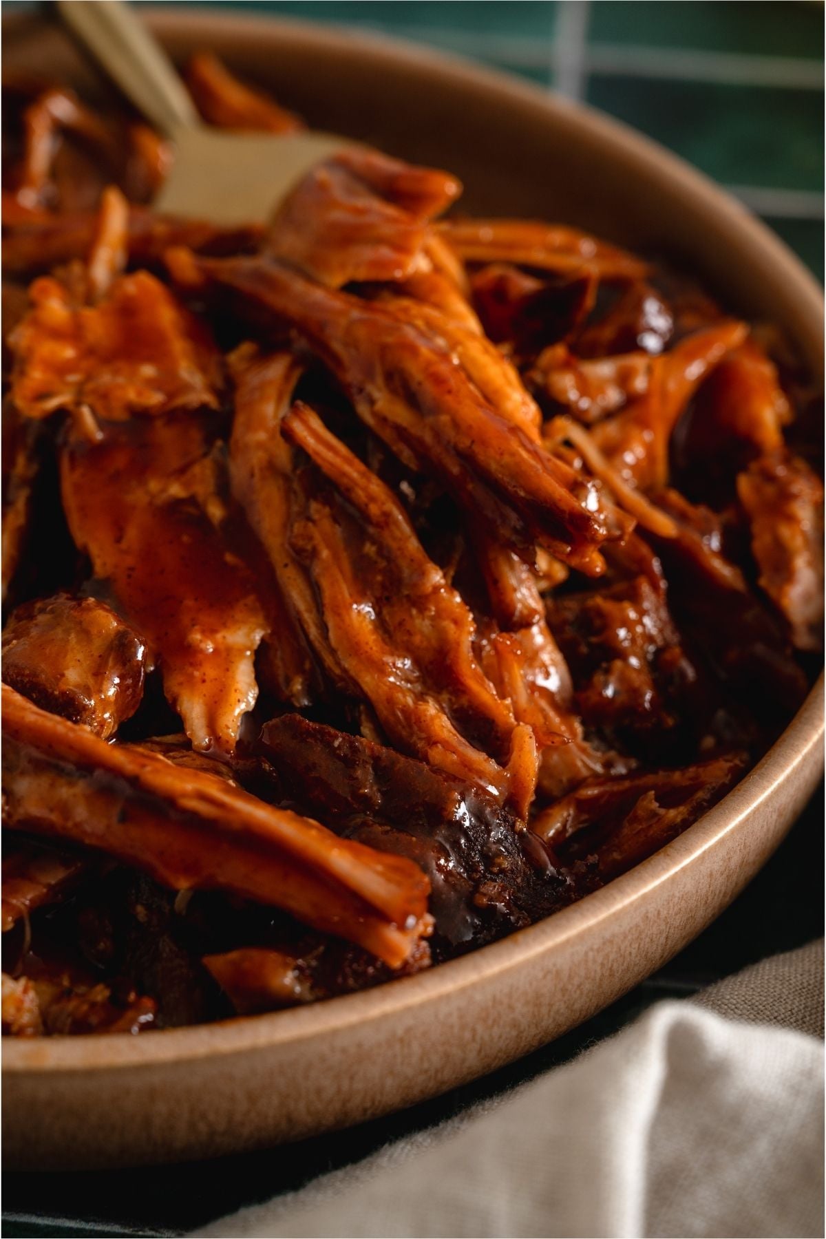 Close up of Slow Cooker Smoky BBQ Pulled Pork in a bowl.