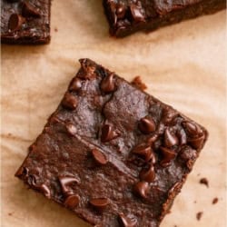 2 Ingredient Pumpkin Brownies cut into squares topped with chocolate chips.