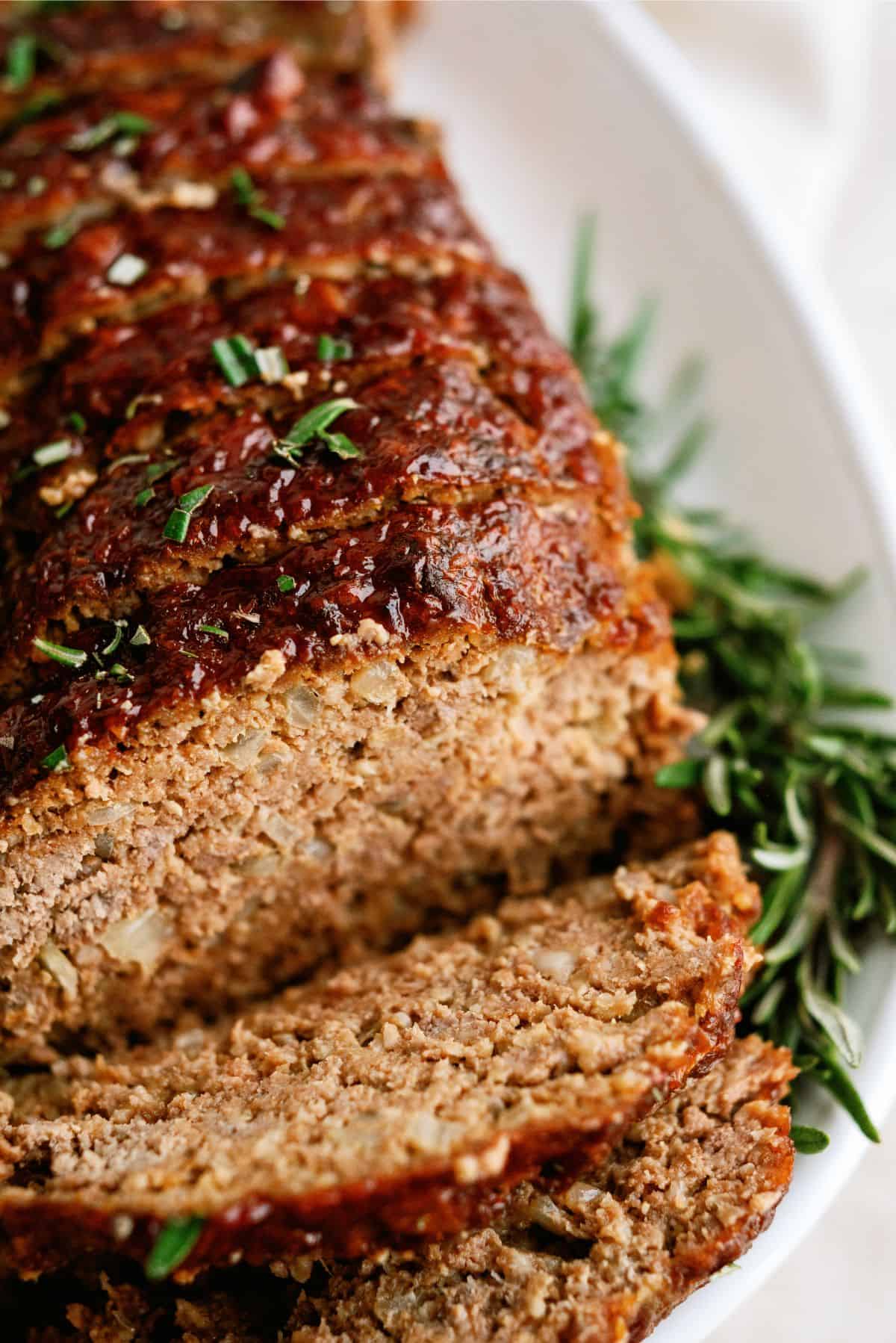 Grandma A’s Meatloaf sliced on a serving plate