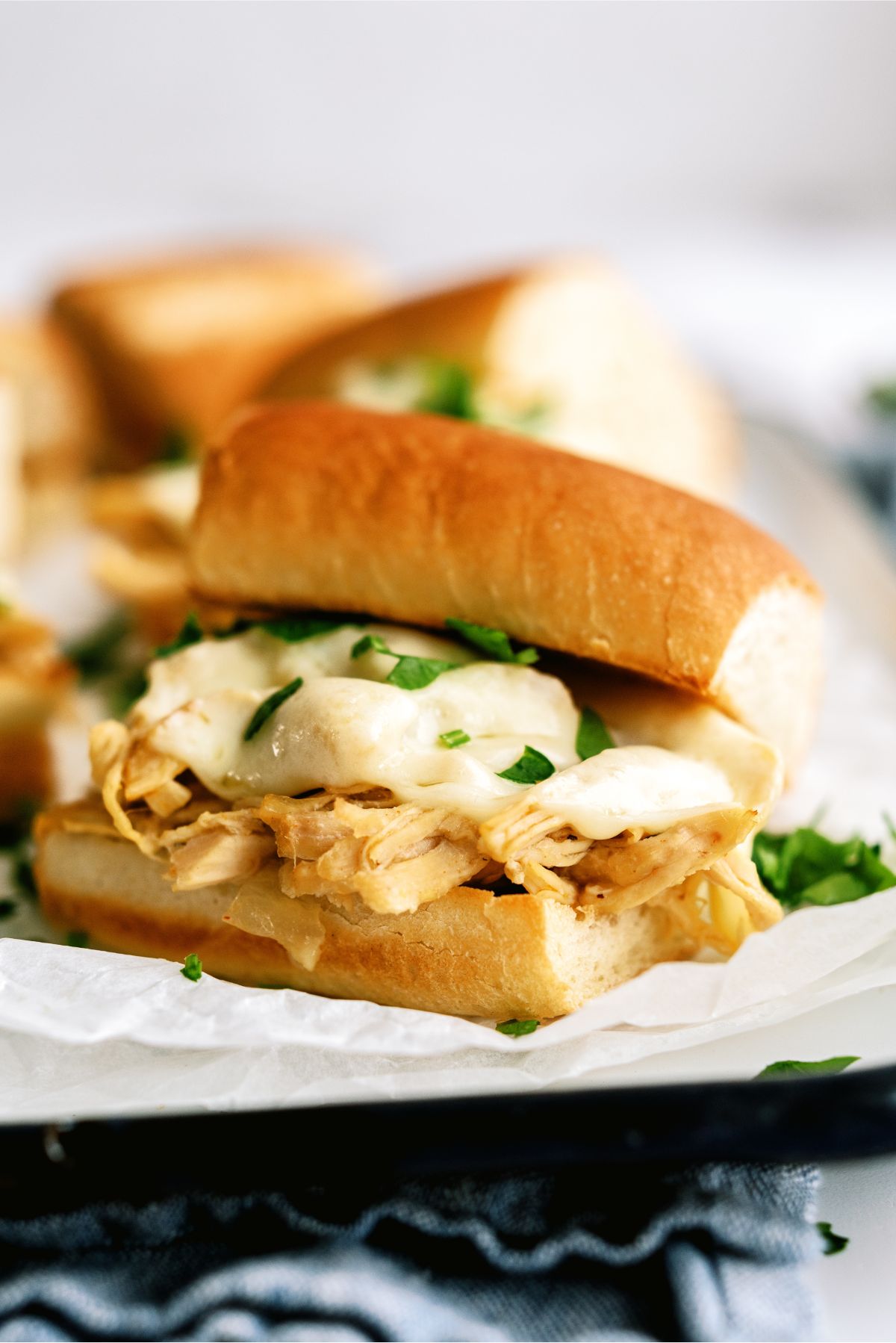 Close up of Instant Pot Chicken French Dip Sandwiches