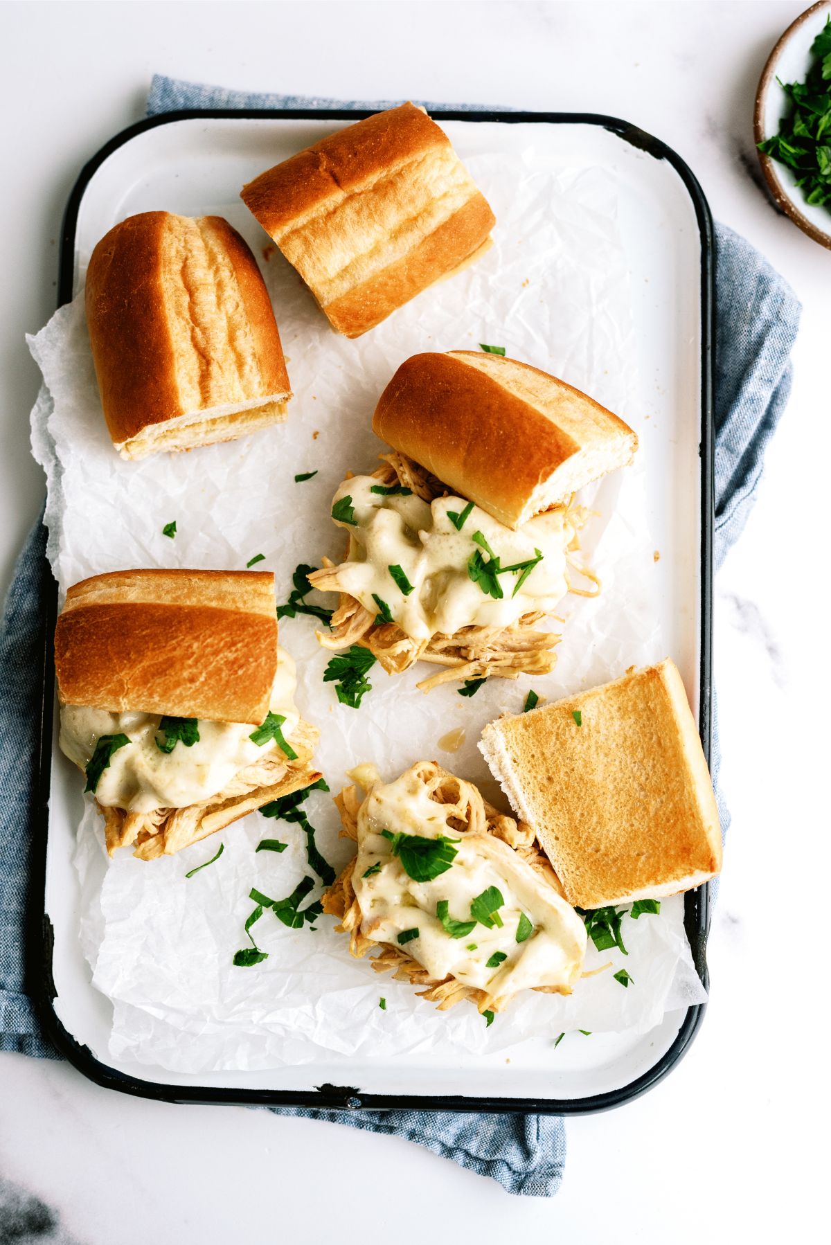 A platter of Instant Pot Chicken French Dip Sandwiches