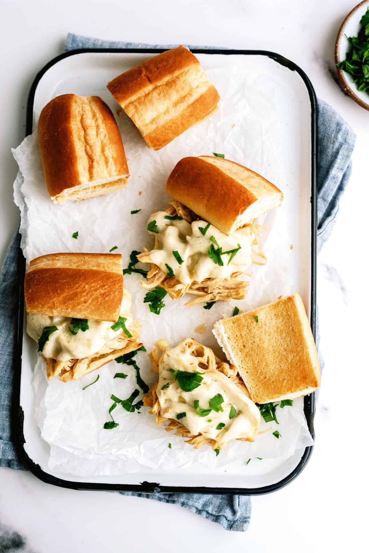 A platter of Instant Pot Chicken French Dip Sandwiches