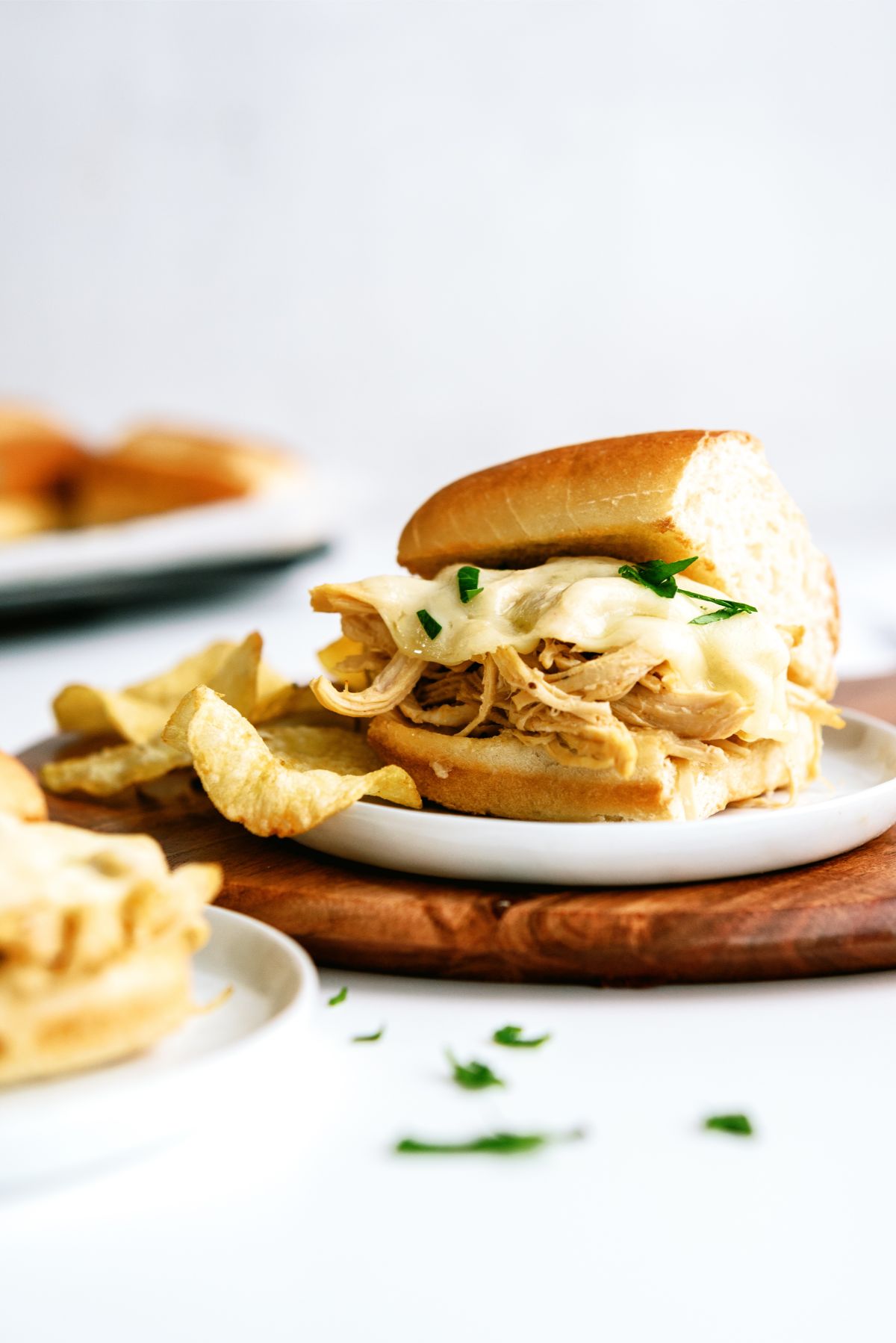 Instant Pot Chicken French Dip Sandwich on a plate with chips