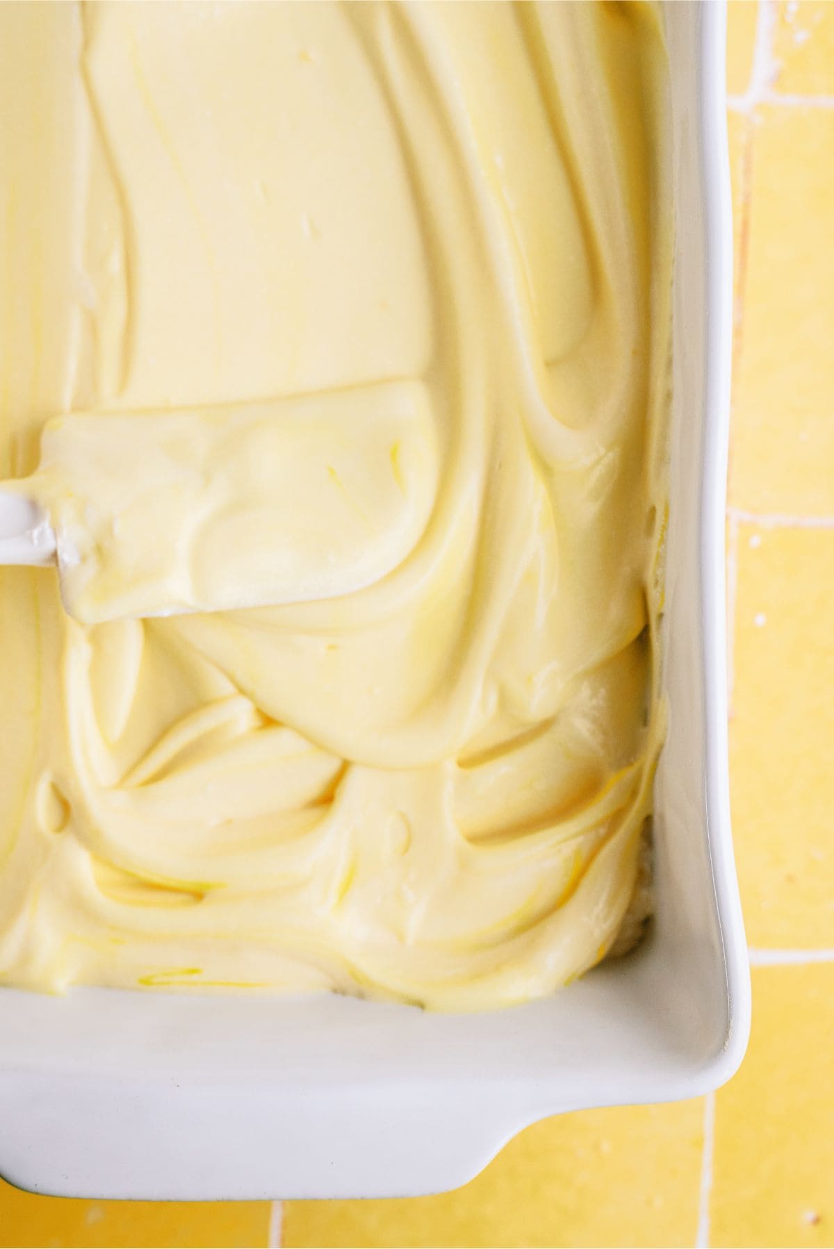 Spreading pudding mixture over cream cheese mixture