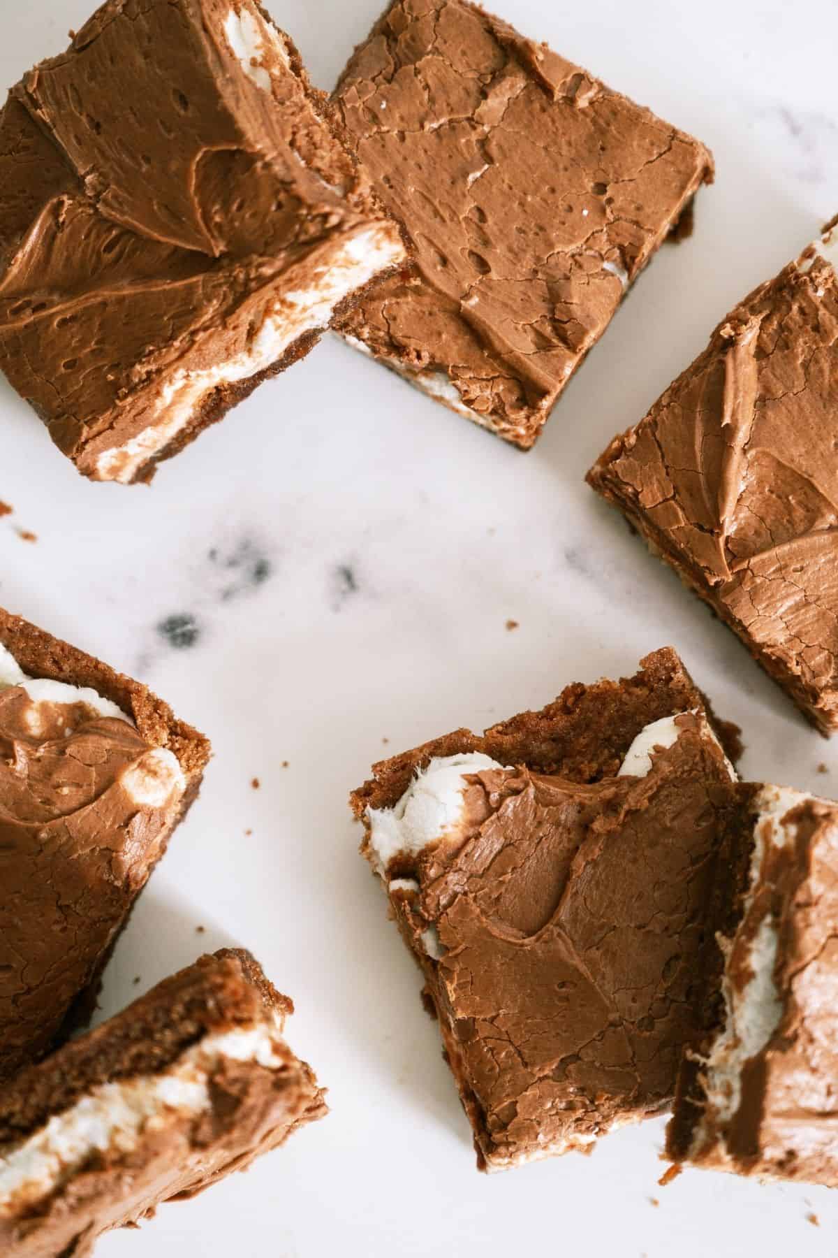 Mom's Famous Chocolate Marshmallow Brownies cut into sqaures on a white background.