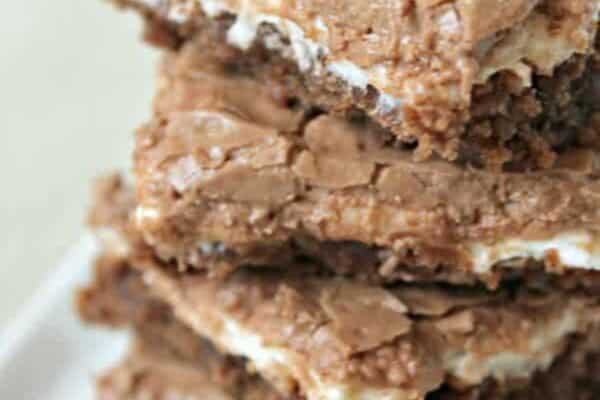 Mom's Famous Chocolate Marshmallow Brownies cut into squares and stacked on a plate