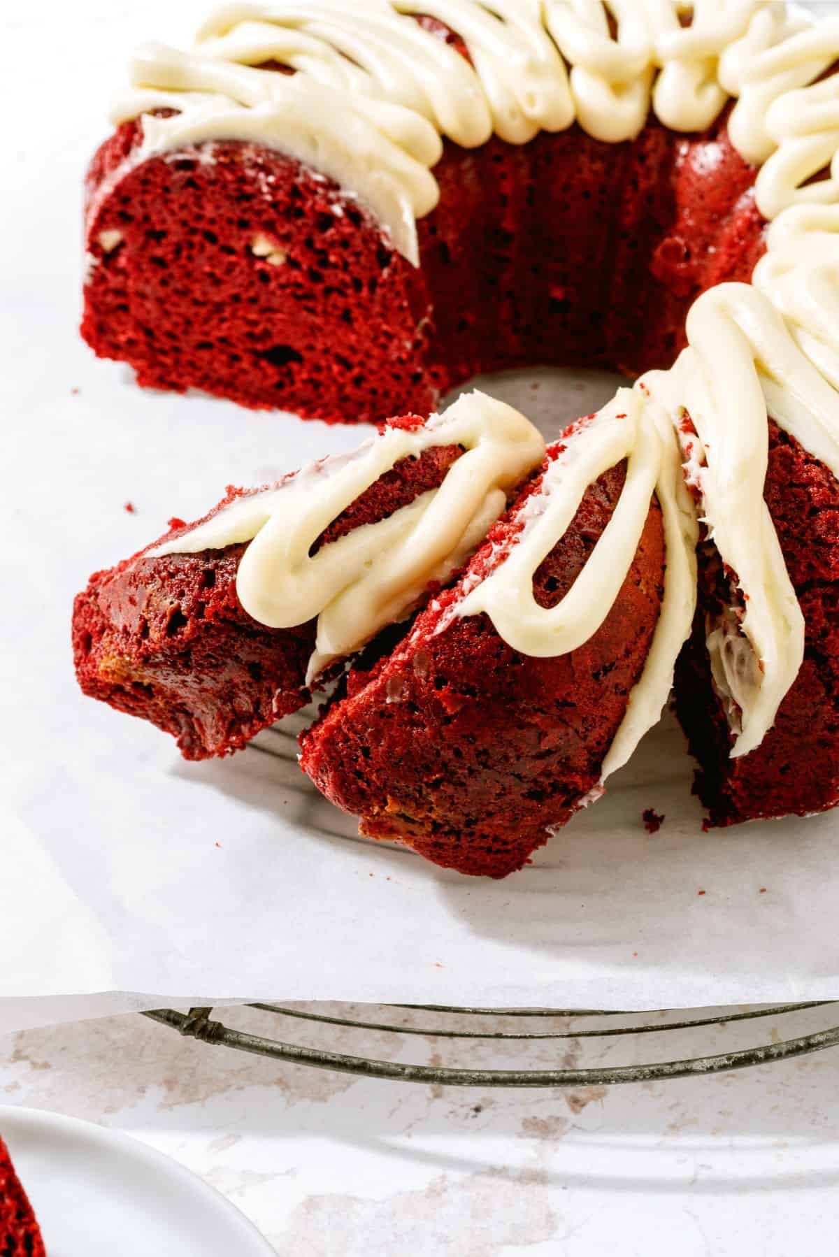 Top view of a frosted Red Velvet Bundt Cake sliced.
