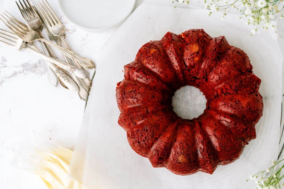 Red Velvet Bundt Cake sitting on a cake stand,