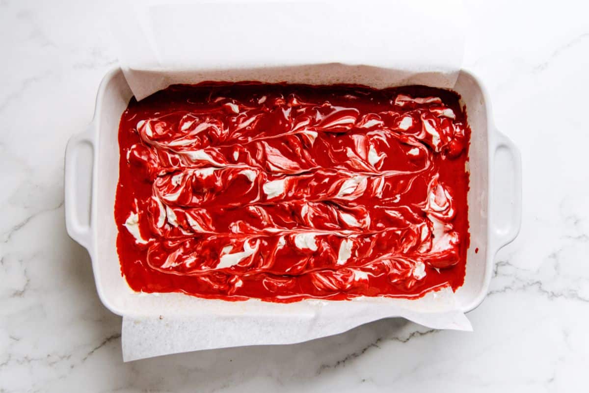 Cake pan filled with Red Velvet Cheesecake Swirl Batter.