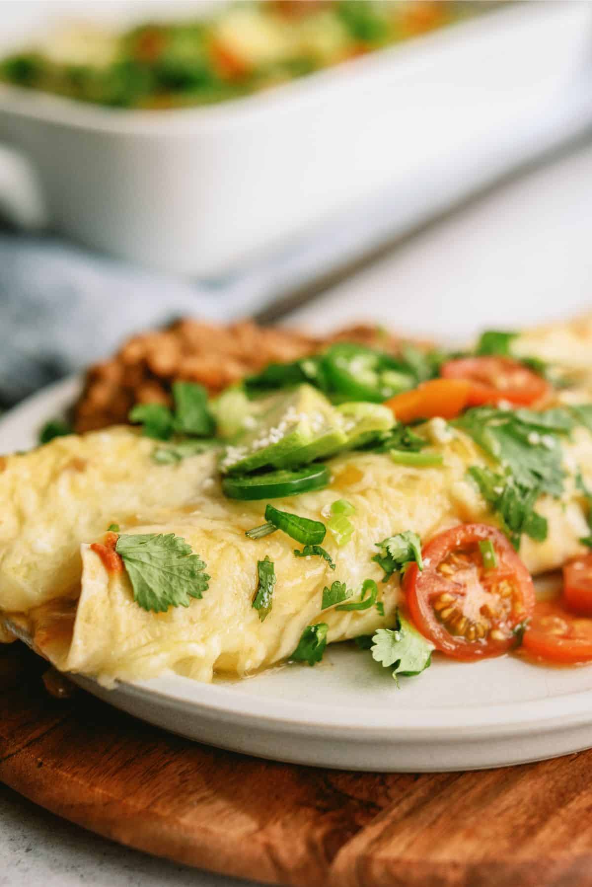 Slow Cooker Chile Verde Pork Enchiladas on a plate