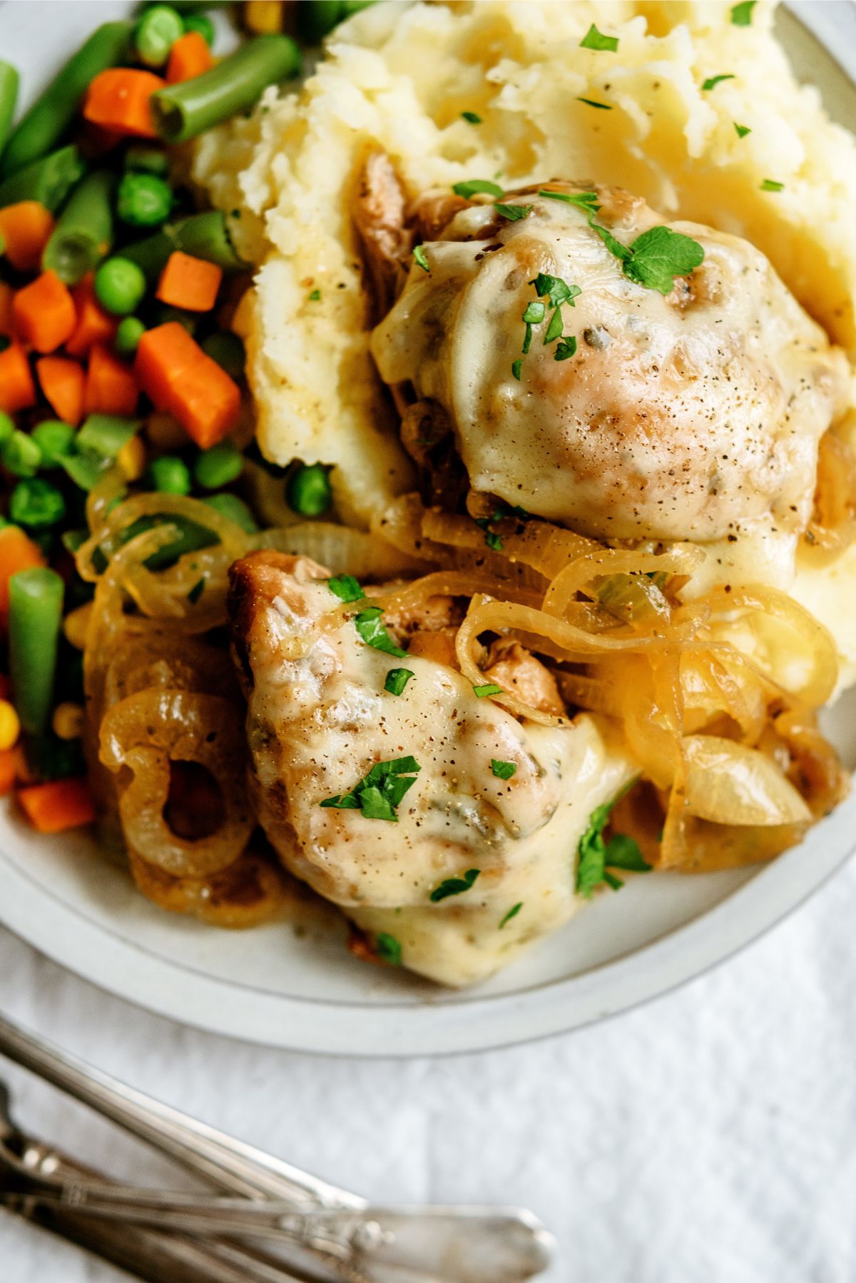Slow Cooker French Onion Chicken on a plate with sides