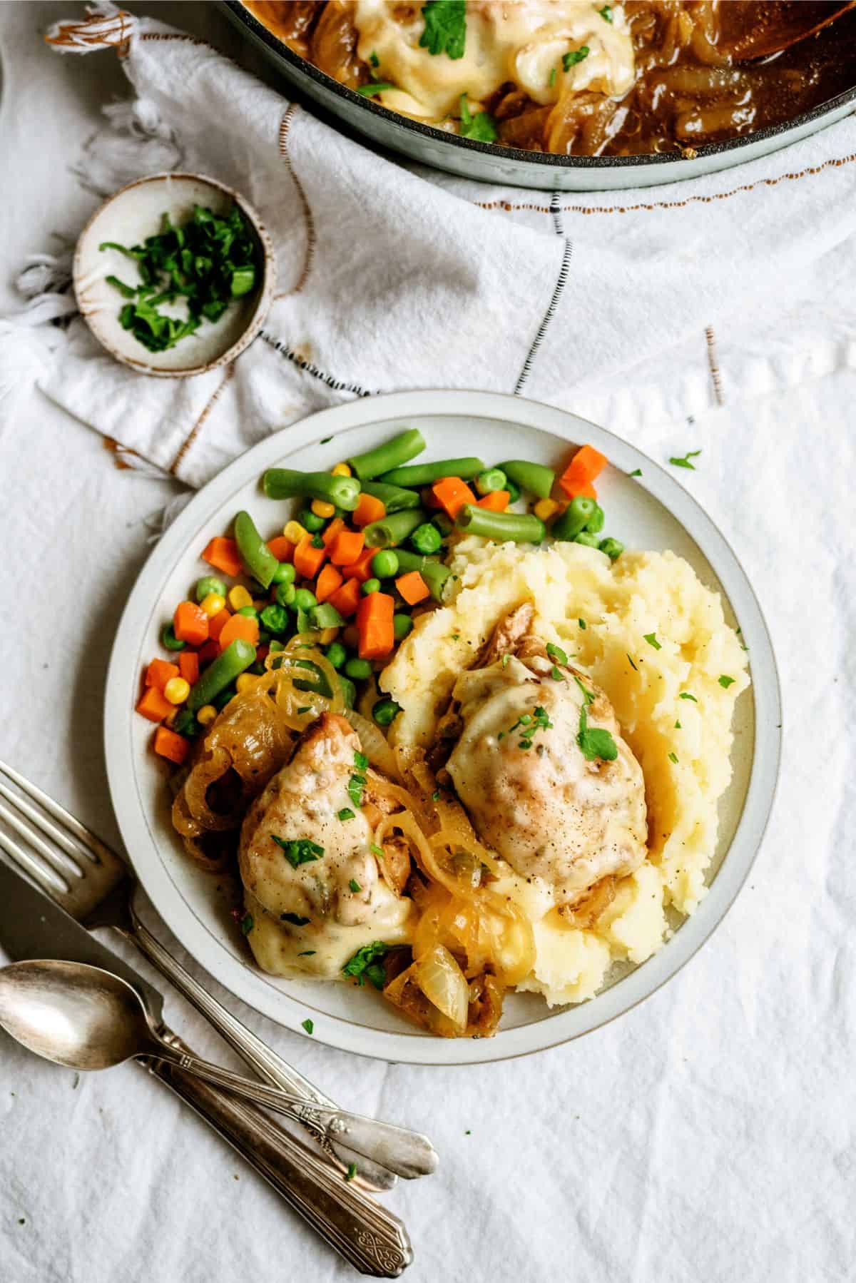 A plate of Slow Cooker French Onion Chicken with sides