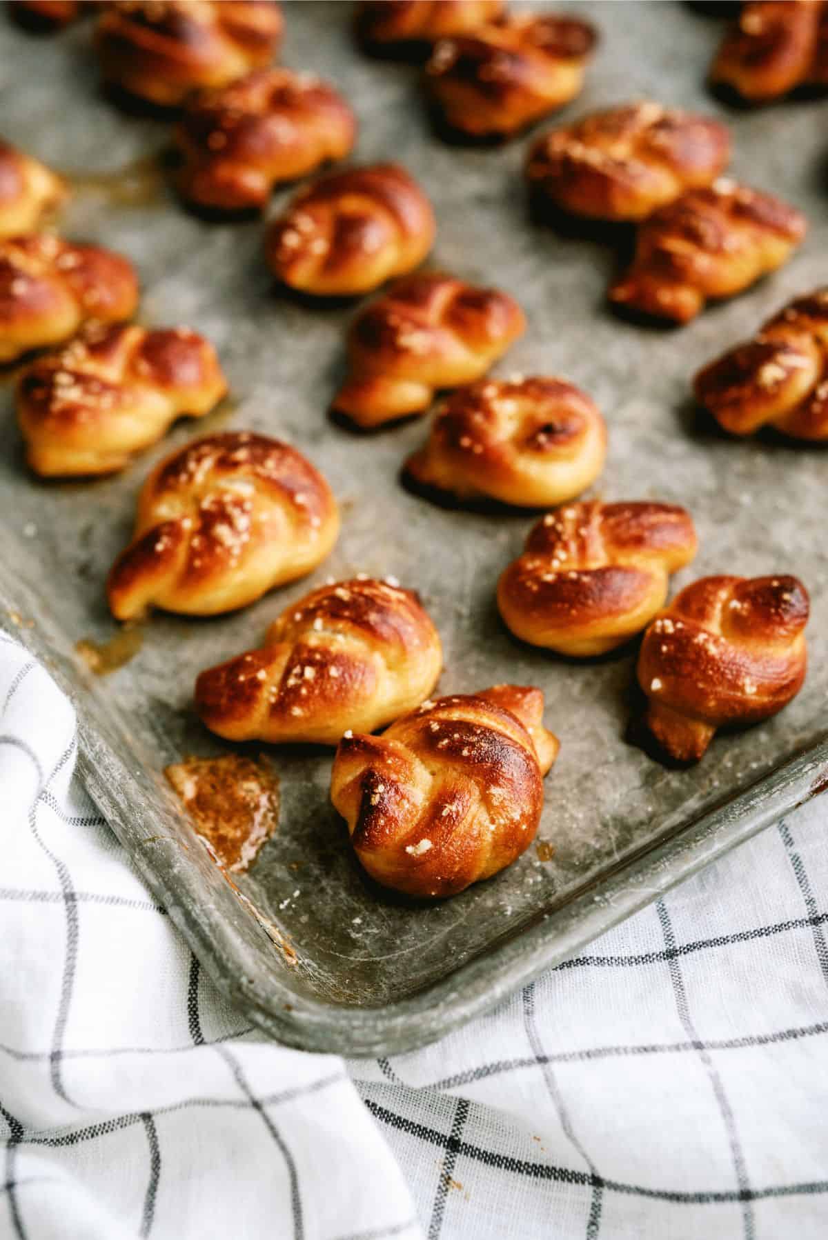 Twisted Soft Pretzel Bites baked on a baking sheet