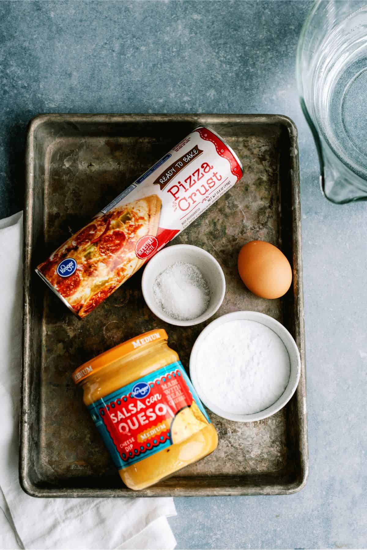 Ingredients for Twisted Soft Pretzel Bites Recipe on a sheet pan