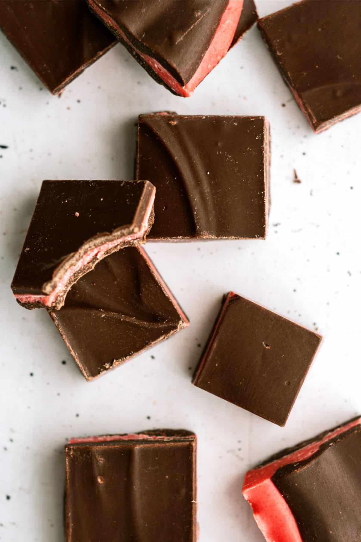 Top view of Valentine's Thin Mints cut into squares with one square missing a bite.