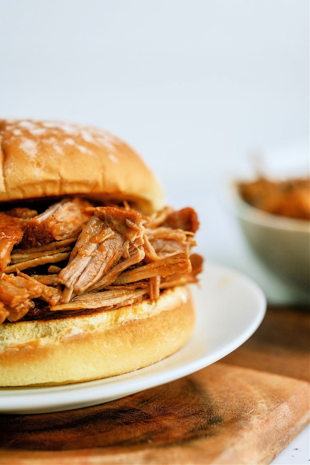 Close up of Slow Cooker BBQ Apricot Pulled Pork Sandwich on a plate