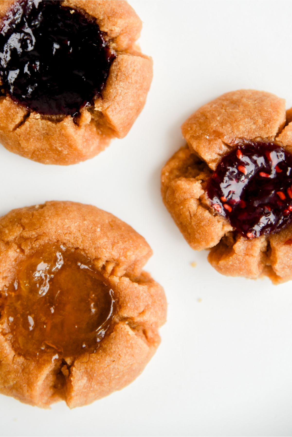 A close up of 3, 5 Ingredient Peanut Butter and Jam Thumbprint Cookies