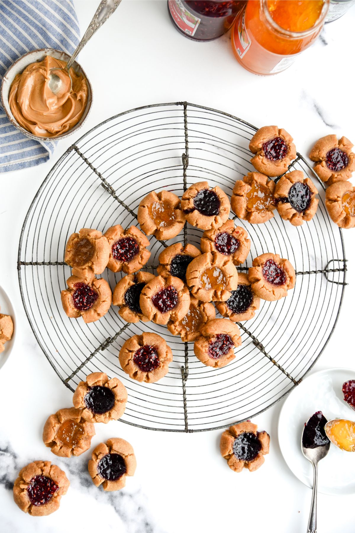 Top view of 5 Ingredient Peanut Butter and Jam Thumbprint Cookies on a cooling rack.
