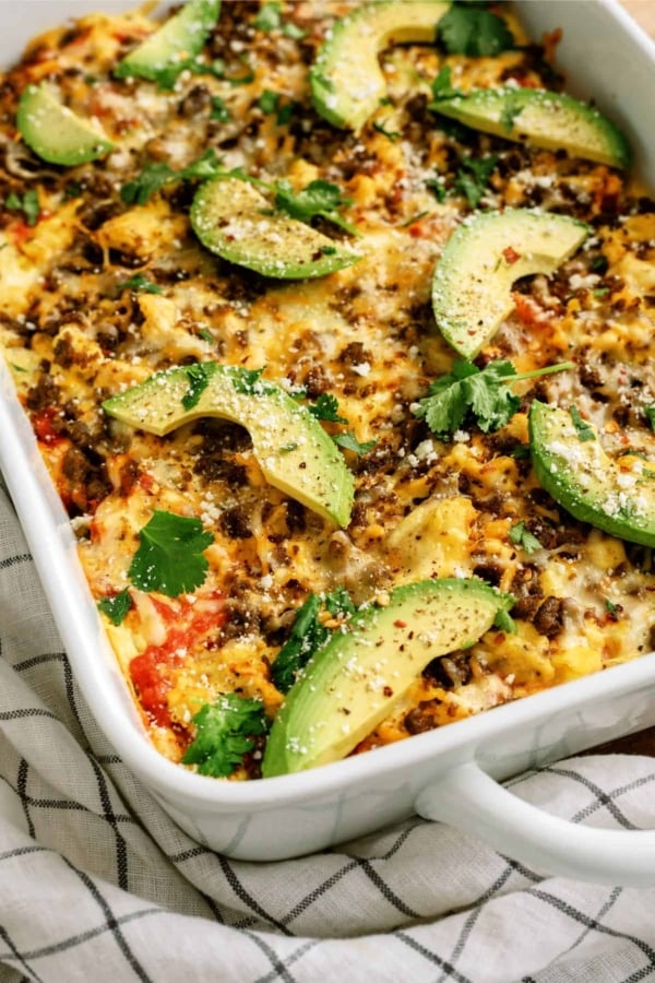breakfast burrito casserole with avocado, cheese, and egg