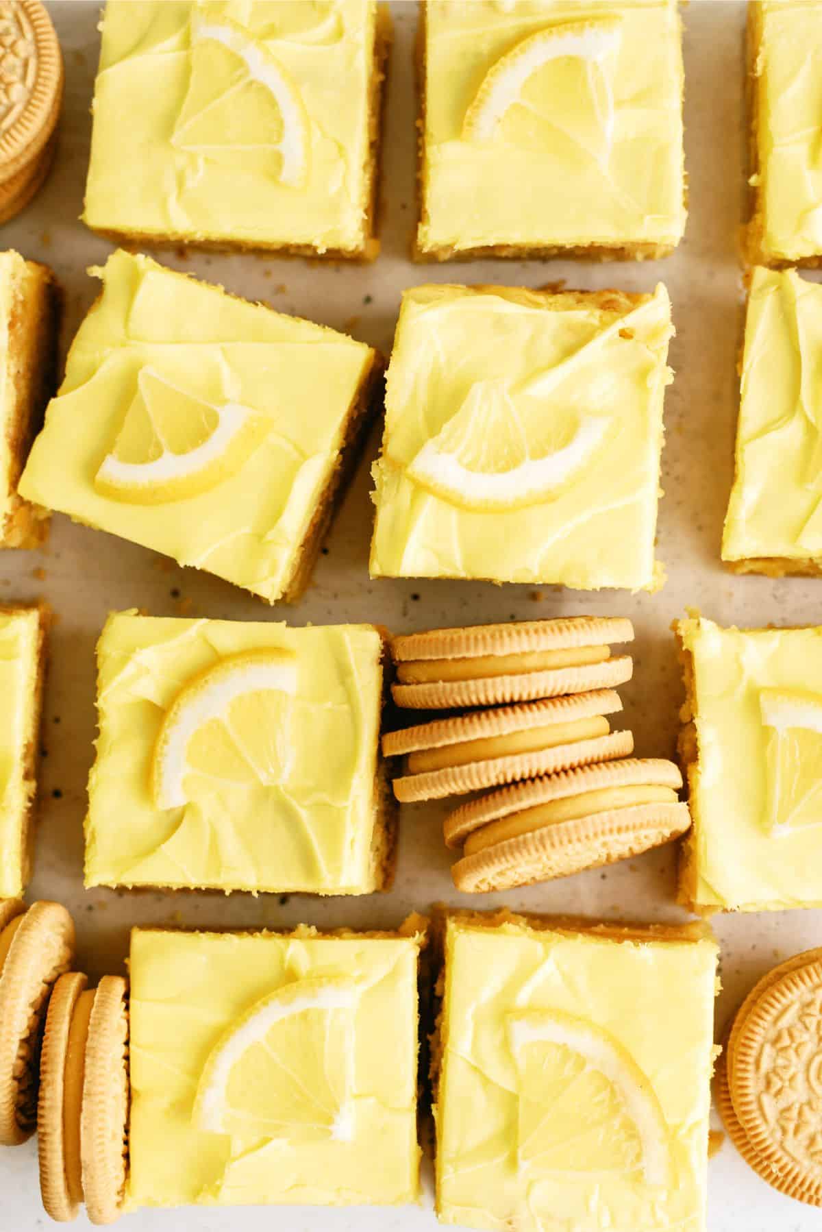 Lemon Cookie Cheesecake Bars cut into squares with cookies