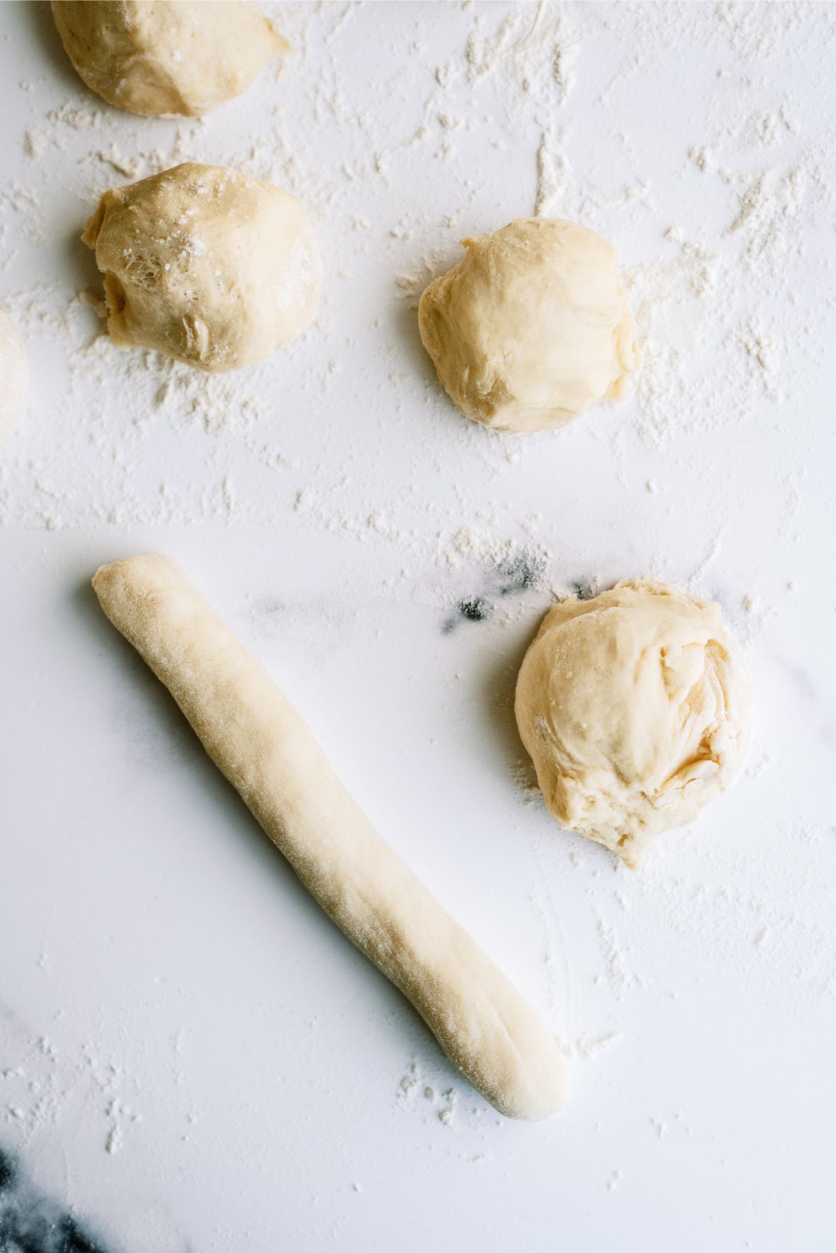 Dough pieces rolled into elongated shapes