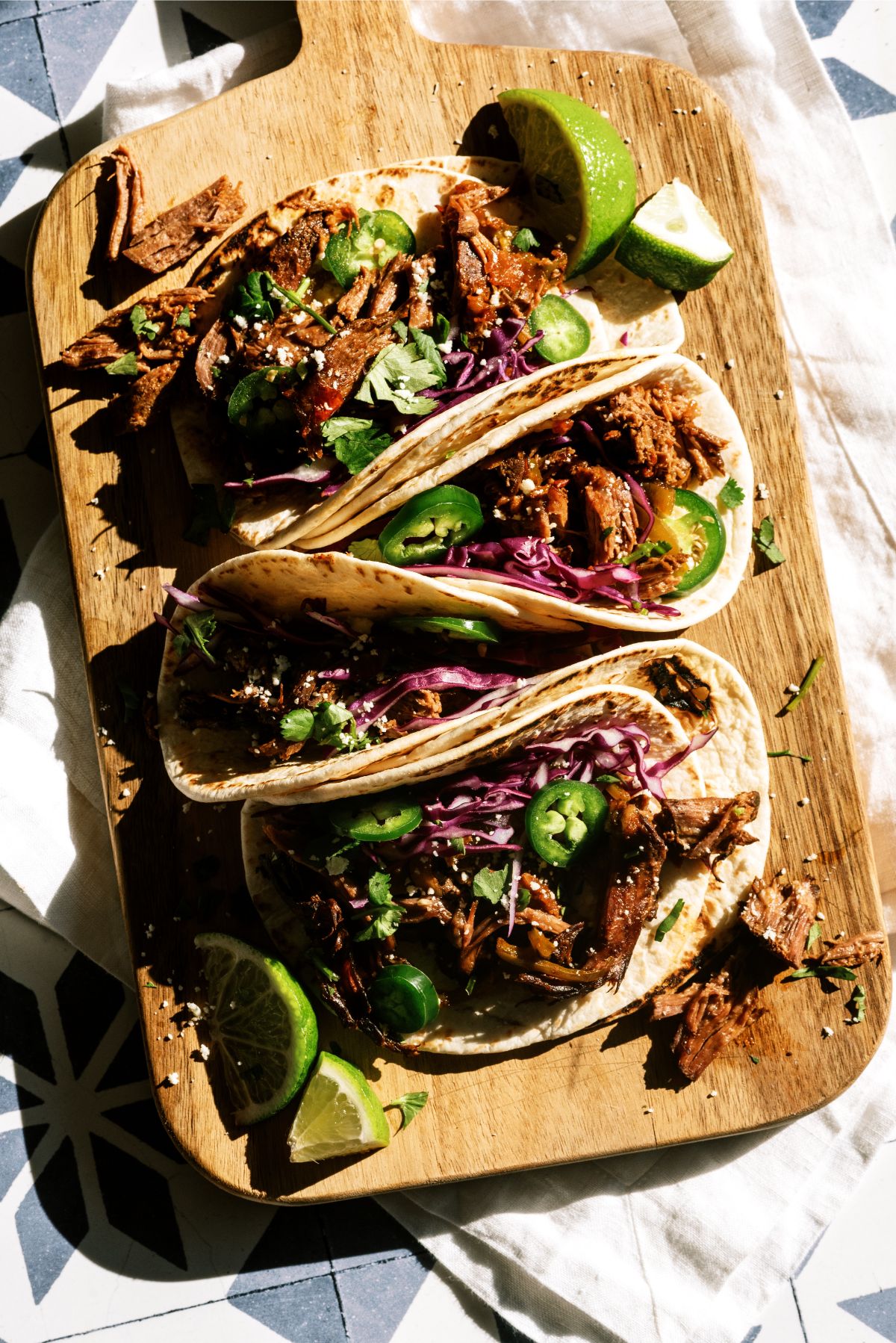 Slow Cooker Beef Carnitas on a cutting board