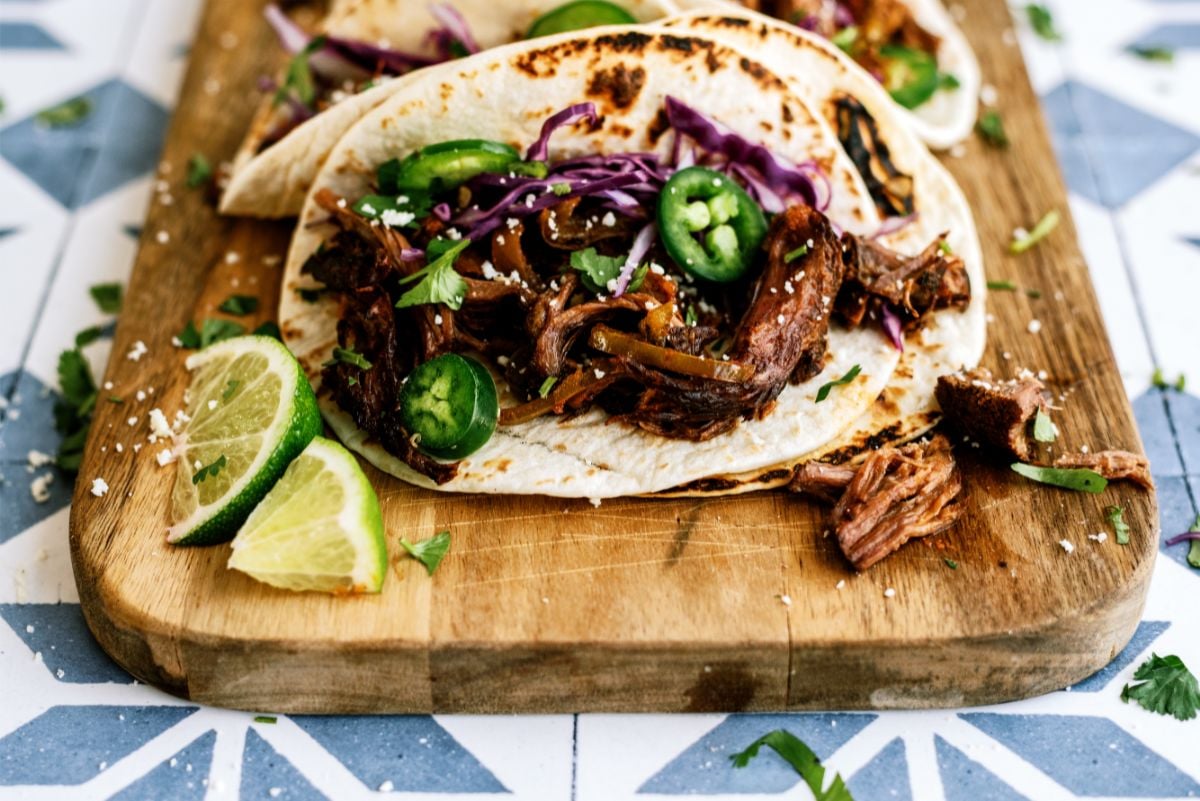 One Slow Cooker Beef Carnitas on a cutting board
