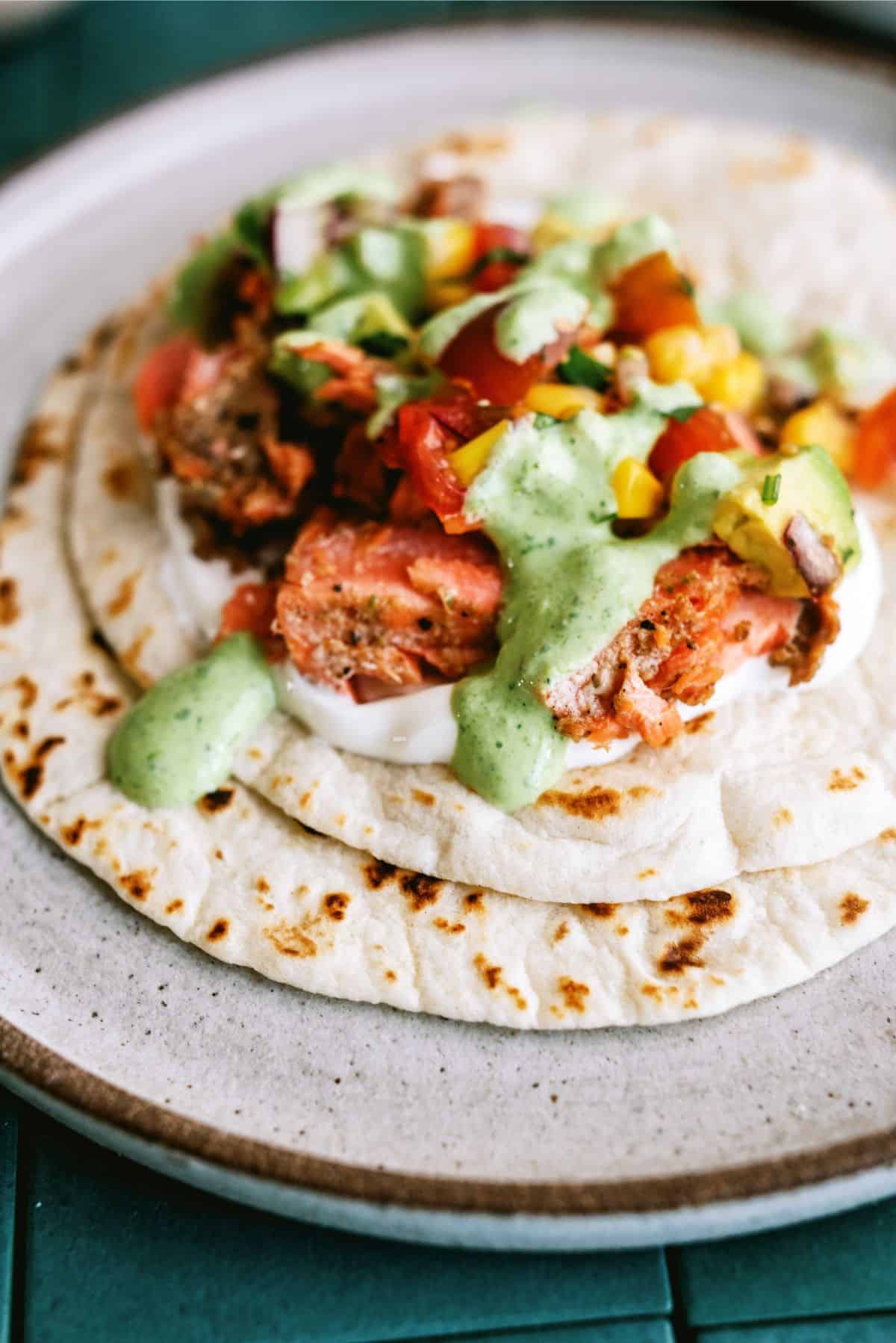 Close up of open faced Blackened Salmon Taco on a plate