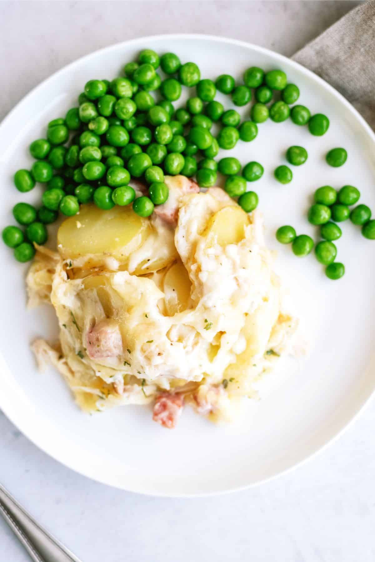 Top view of a serving of Chicken Cordon Bleu and Potatoes Casserole on a plate