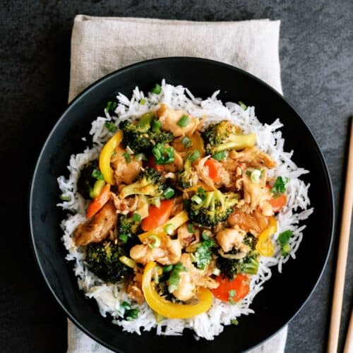 instant pot chicken and veggie stir fry on a plate with rice