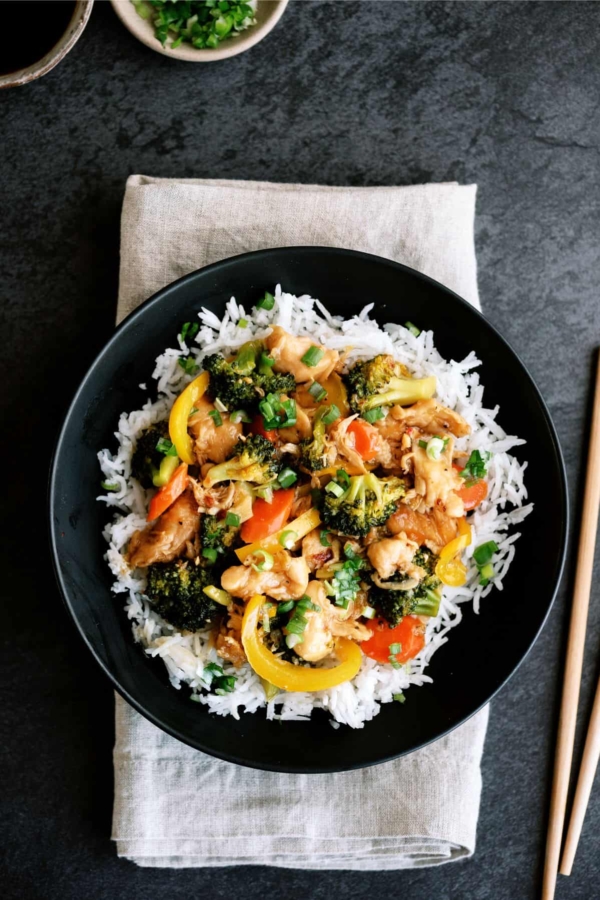 instant pot chicken and veggie stir fry on a plate with rice