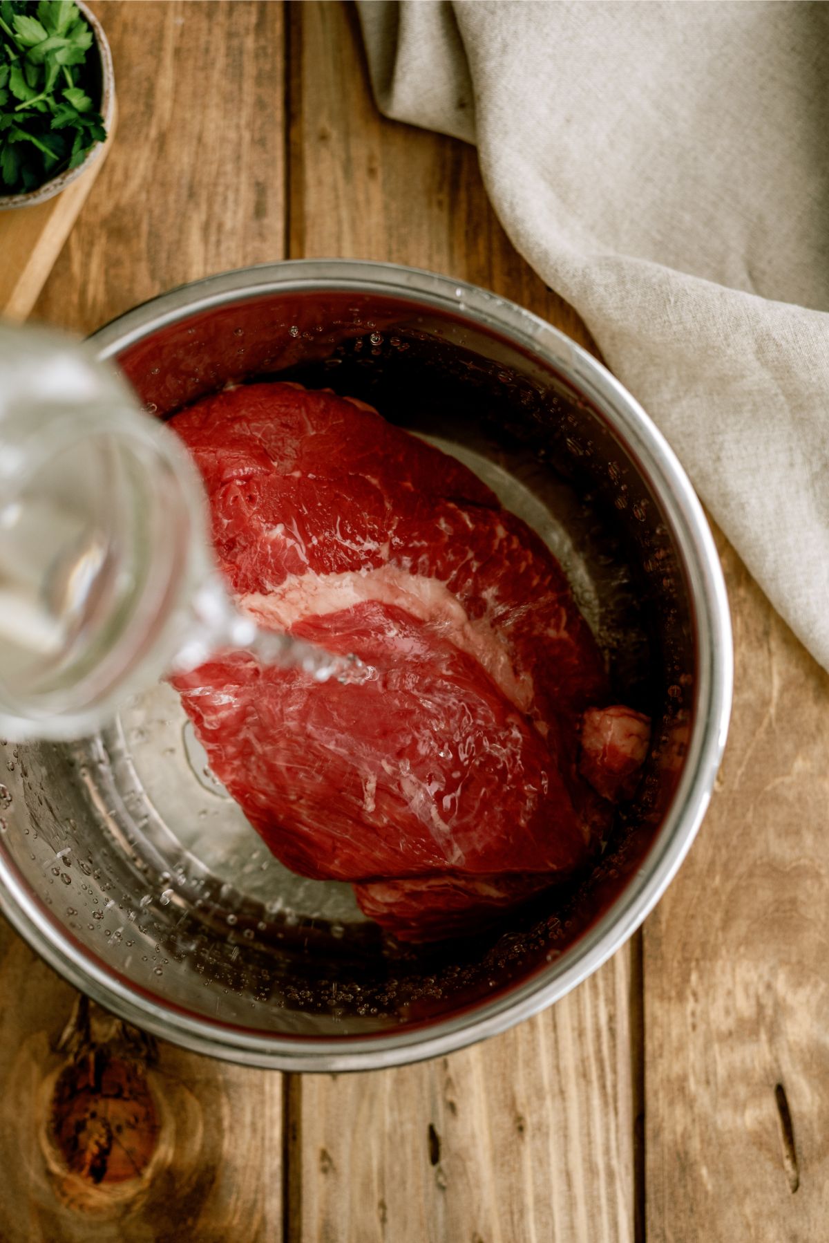 Pouring water over beef in Instant Pot