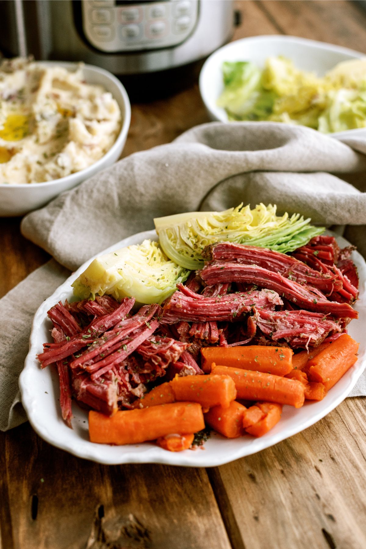 Instant Pot Corned Beef and Cabbage on a serving platter