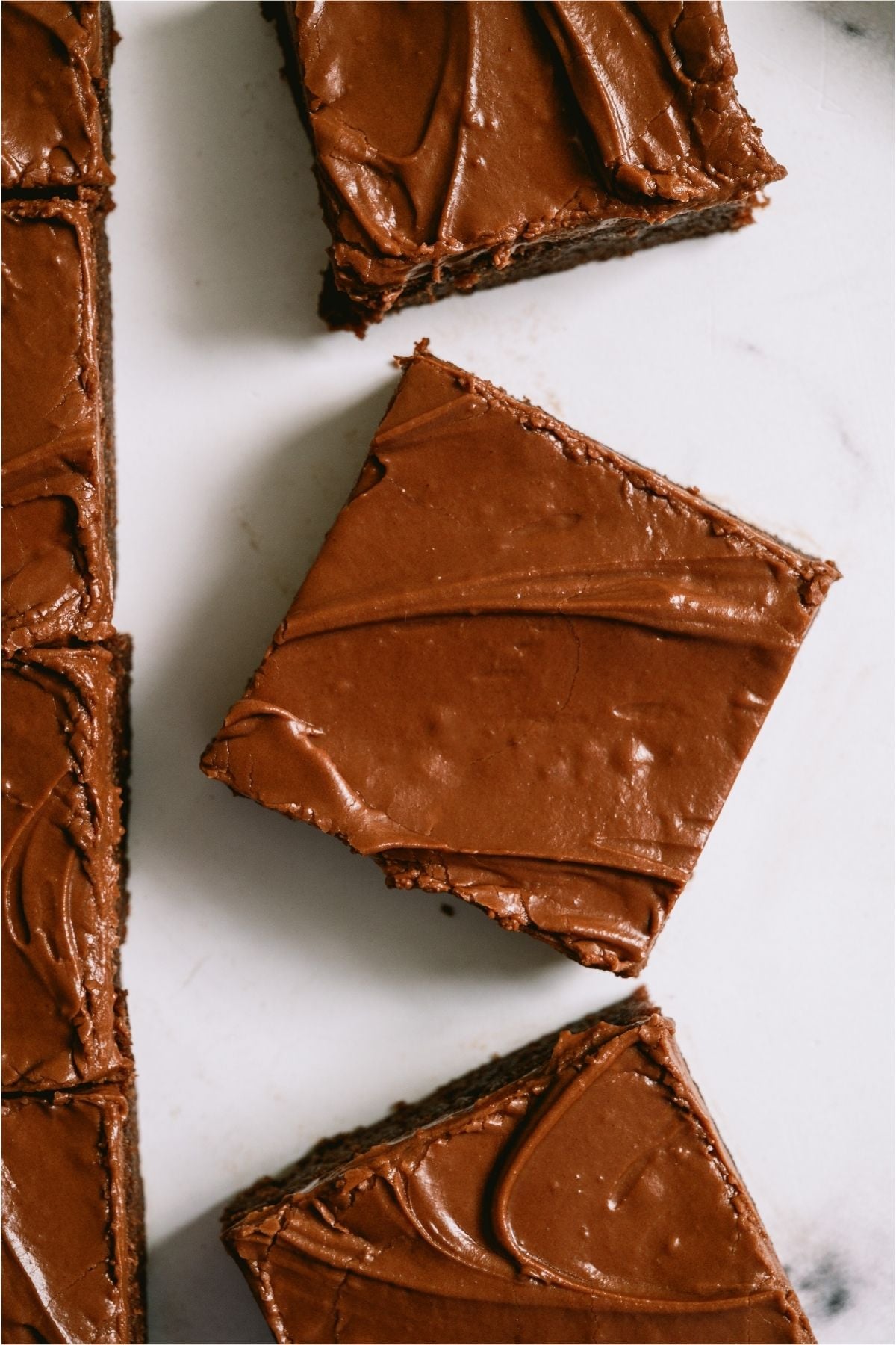 Top view of three Lunch Lady Brownies cut into squares.