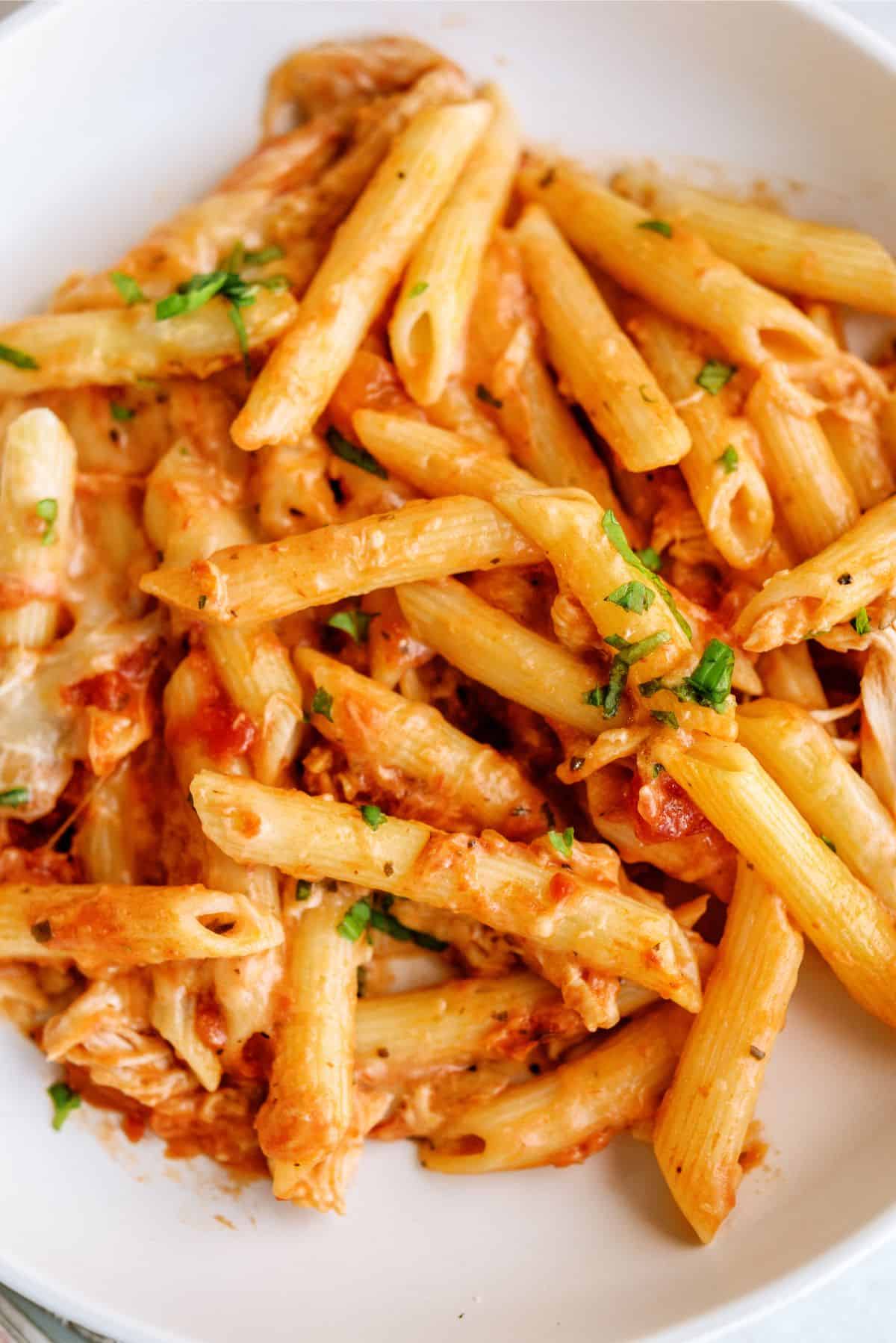 Close up of a serving of Pink Sauce Chicken Pasta Bake in a bowl