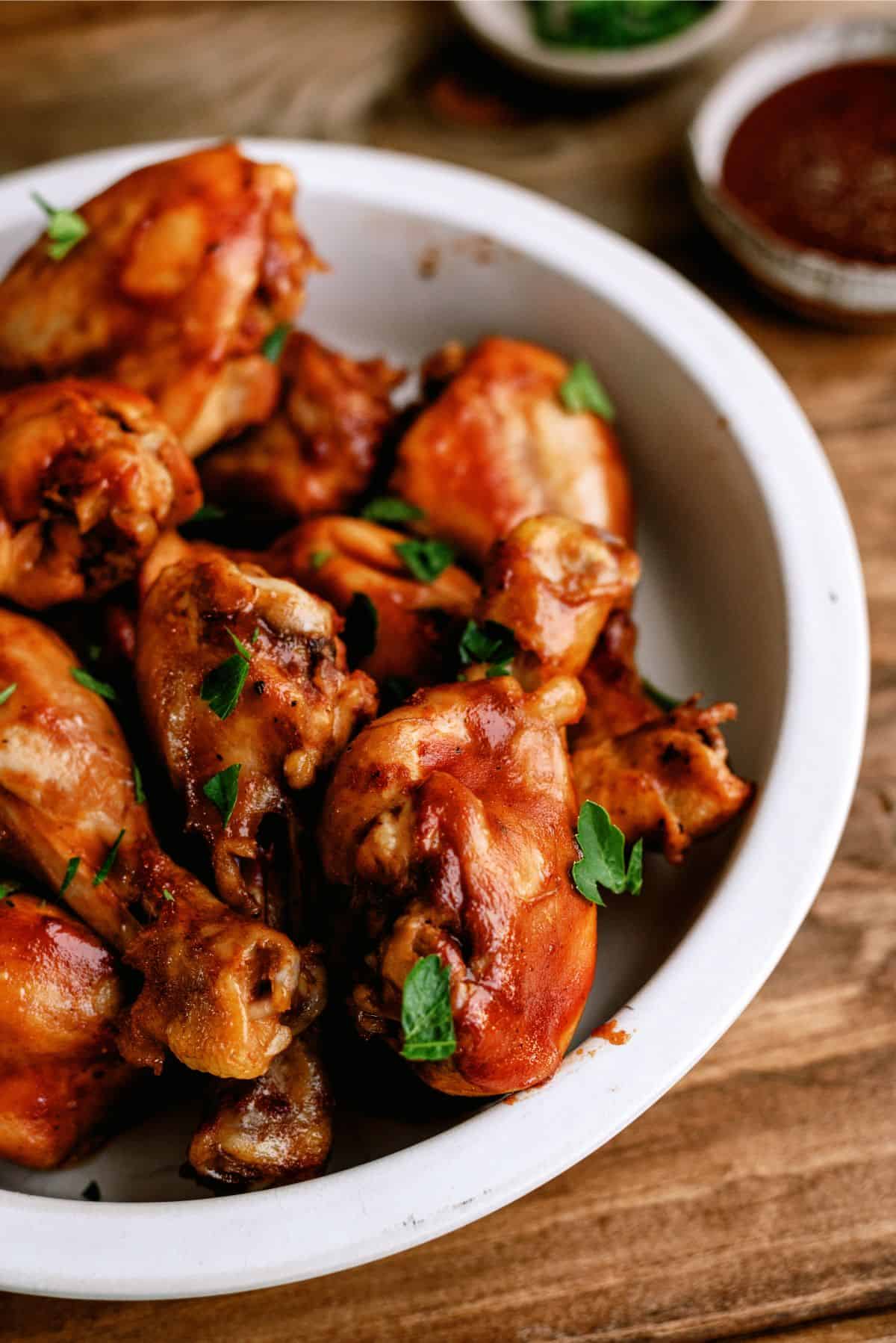 A bowl of Slow Cooker BBQ Chicken Drumsticks