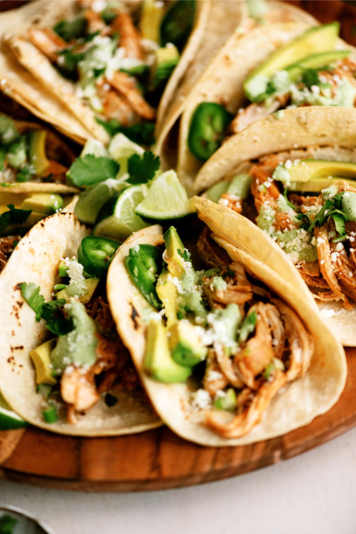 Close up of a platter of Slow Cooker Chicken Tinga Tacos
