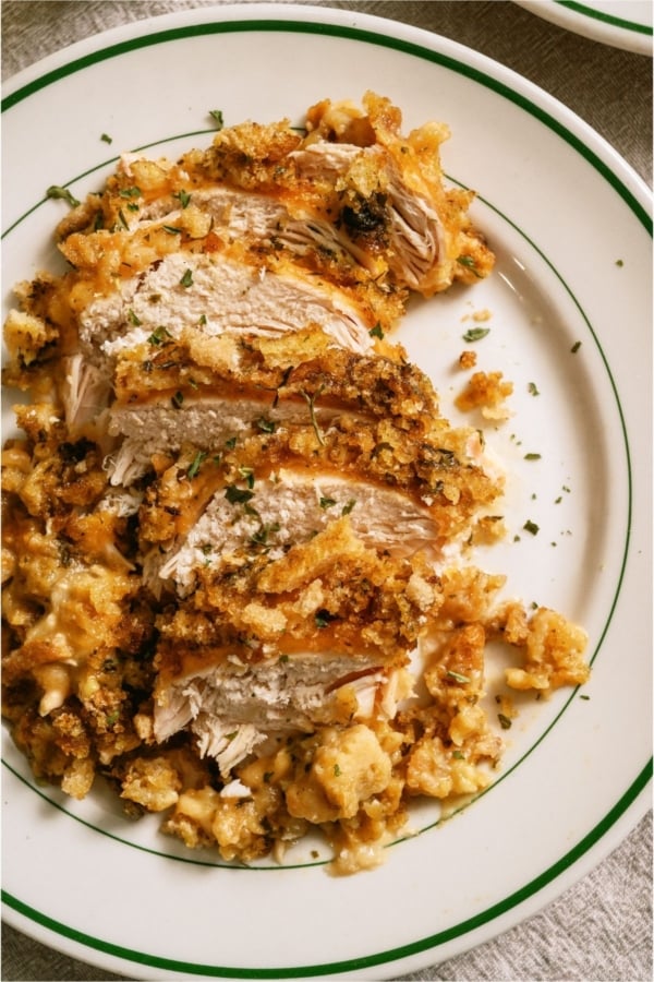 Slow Cooker Swiss Chicken sliced on a plate.