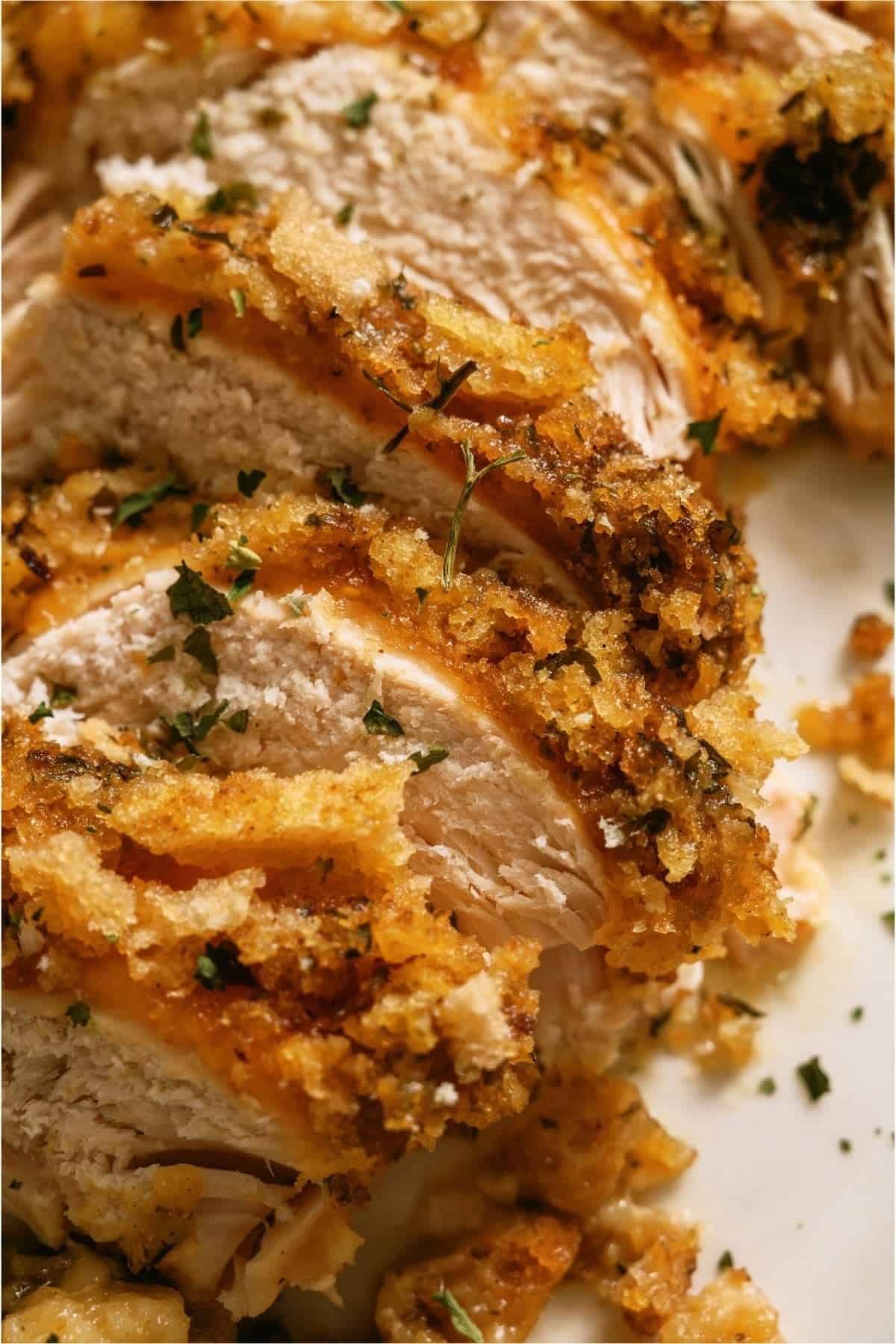 Close up of sliced Slow Cooker Swiss Chicken on a plate.