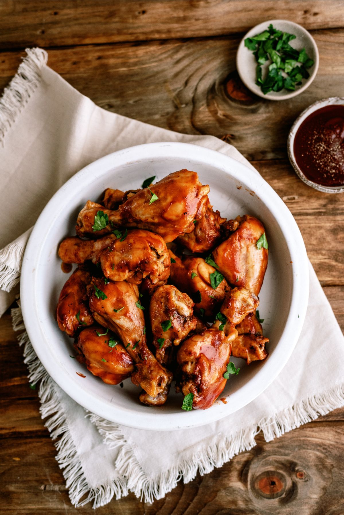 Top view of a bowl of Slow Cooker BBQ Chicken Drumsticks