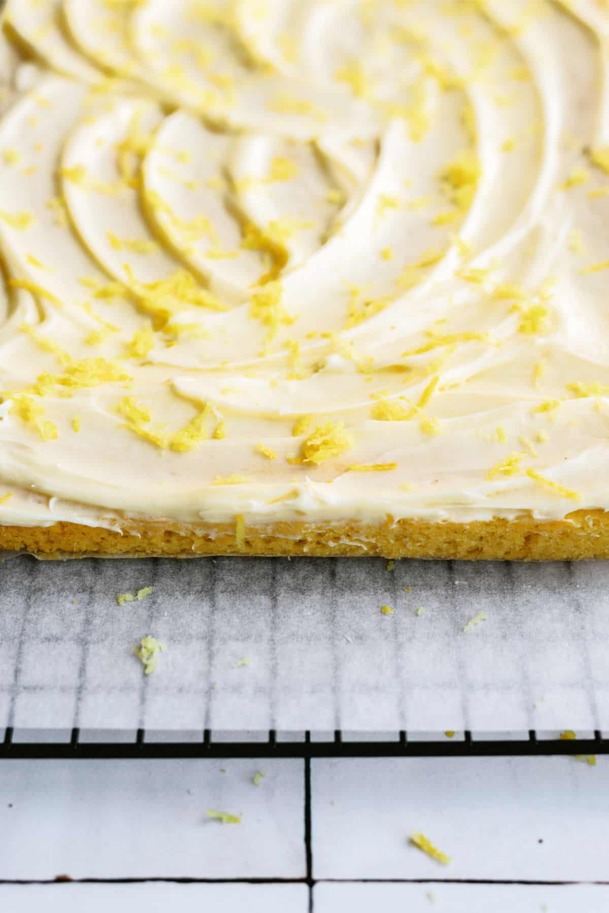 Lemon Brownies with Lemon Frosting sprinkled with lemon zest