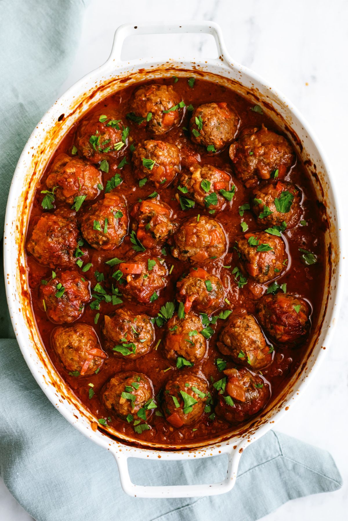 Top view of a pan of Porcupine Meatballs in sauce