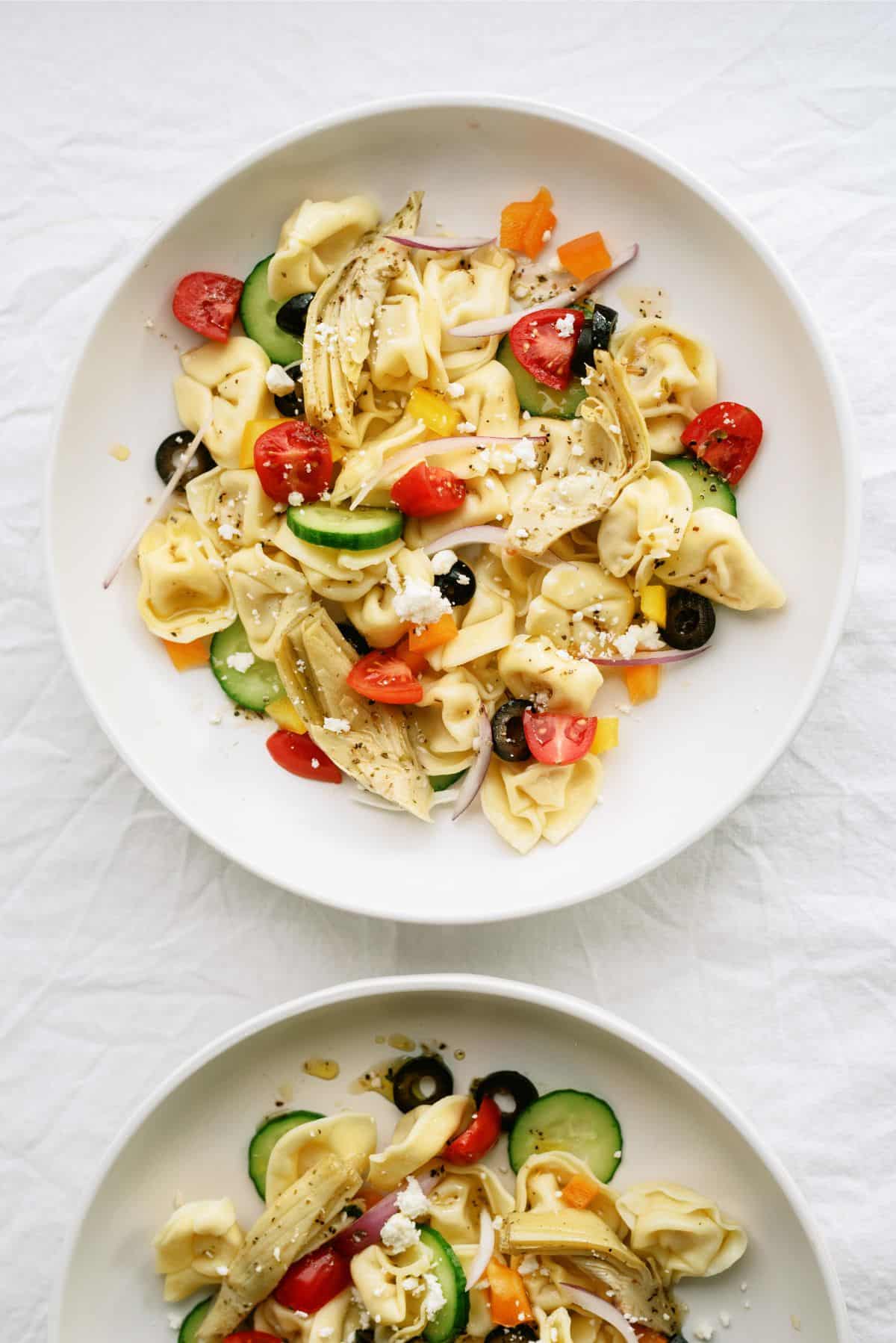 Two servings of Tortellini Pasta Salad on plates