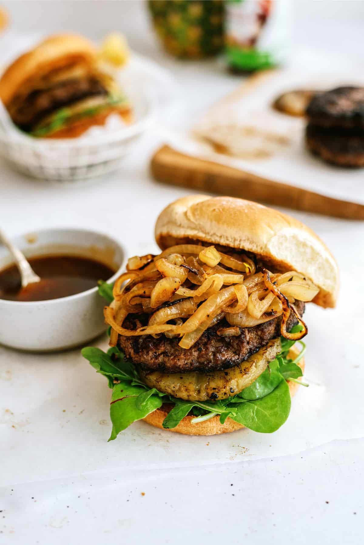 Grilled Teriyaki Burgers topped with caramelized onions