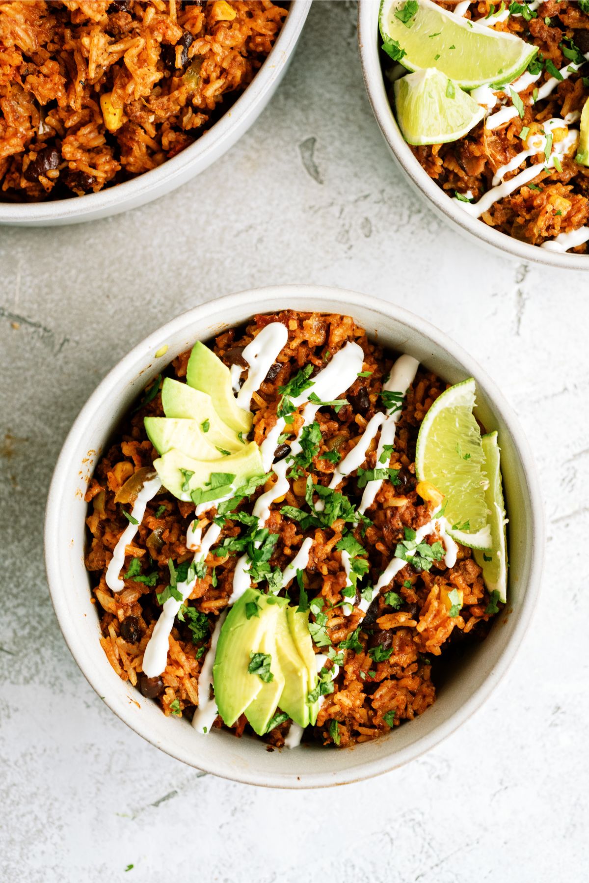 Instant Pot Ground Beef Burrito Bowls in bowls with toppings