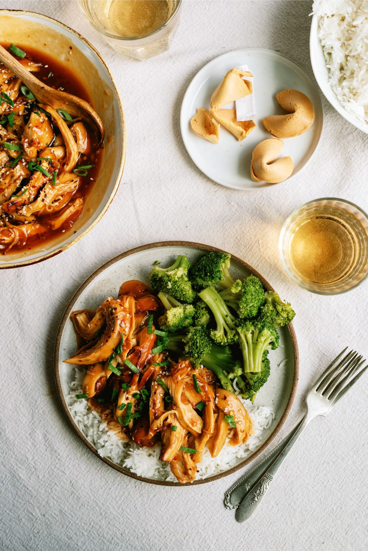 Instant Pot Honey Sesame Chicken on a plate with rice and broccoli